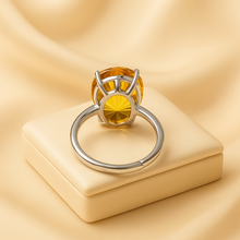 Lifestyle image: sunlight hitting citrine ring, symbolizing abundance and joy.