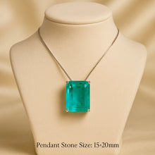 Close-up of Paraiba tourmaline pendant on cream display bust