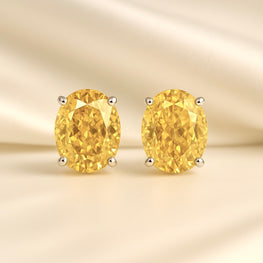 	“Golden citrine stud earrings in sterling silver handmade by Curación Holística.”