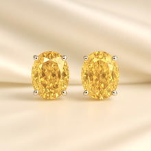 	“Golden citrine stud earrings in sterling silver handmade by Curación Holística.”