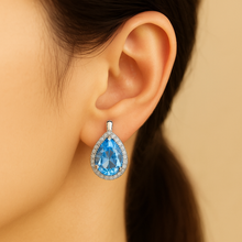 	Close-up of sterling silver craftsmanship and quartz accents wearing on ear