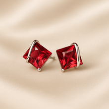 Sterling silver wave earrings with red gemstone