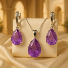 Matching necklace and earrings with faceted violet gemstones