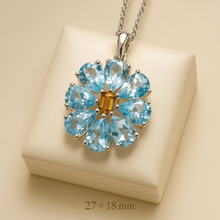	Handmade aquamarine flower necklace with citrine center in sterling silver. With measurements 