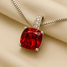 “Hand holding ruby and white quartz necklace, highlighting artisanal detail.”