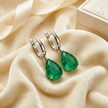 Verdant Tears of the Earth: Emerald & Sterling Echoes
