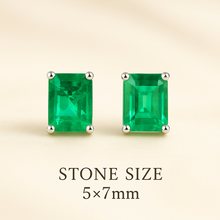	Handmade gemstone earrings with vivid green glass-filled emeralds