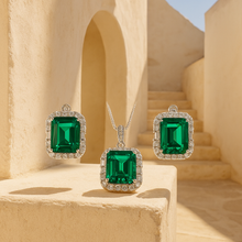 Green gemstone jewelry set photographed under studio lighting
