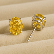 “Luxury citrine earrings symbolizing abundance and joy, crafted in sterling silver.”