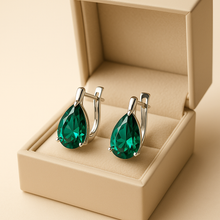 “Elegant pear-shaped Nano-Emerald earrings crafted in Spain with 925 Sterling Silver, exclusive Curación Holística design.”