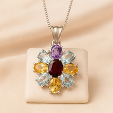 Multigemstone sterling silver necklace on cream velvet stand