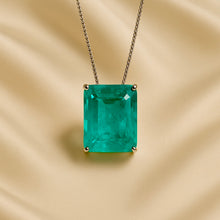 Emerald-cut blue-green pendant displayed elegantly