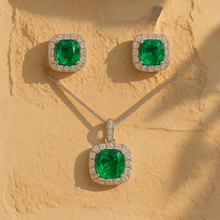 Coordinated silver jewelry set with vibrant green crystals