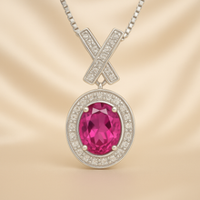 Elegant statement jewelry piece featuring ruby and quartz on satin background