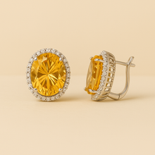 	Handmade sterling silver citrine earrings in oval shape