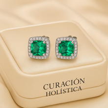 	Crystal halo earrings in luxury packaging labeled Curación Holística