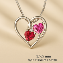 .	“Detailed image showing size dimensions and carat weight of ruby red and rose topaz heart pendant.”