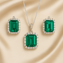 Nano emerald necklace and earrings set in sterling silver on satin background