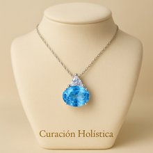 Close-up of handcrafted blue gemstone pendant in sterling silver