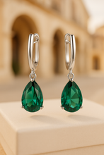 Model wearing emerald teardrop earrings with boho summer outfit