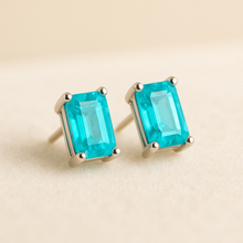 Small blue gemstone earrings with minimalist silver setting