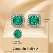 	Crystal halo earrings in luxury packaging labeled Curación Holística