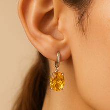 Statement gemstone earrings in sterling silver for women on a model ear