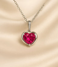 Ruby Heart Necklace on a Jewelry Mannequin with Cream Drapery