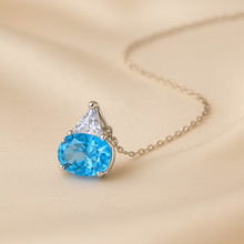 Elegant artisan jewelry with blue topaz and white quartz detailing