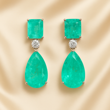 	Close-up of sterling silver earrings with turquoise Paraiba tourmaline and white quartz