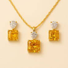 	Elegant gold-toned necklace and earrings with yellow citrine stones
