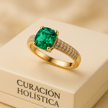 Emerald and white quartz gold ring on luxury cream jewelry box