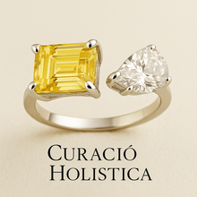 “Handmade adjustable sterling silver ring featuring an emerald-cut citrine and a pear-shaped white quartz by Curación Holística, showcased against a soft cream velvet background.”

