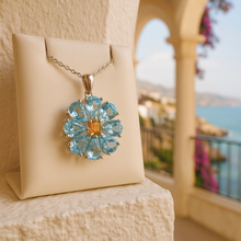 Luxury healing crystal pendant with aquamarine and citrine stones putting on meditranian coast 