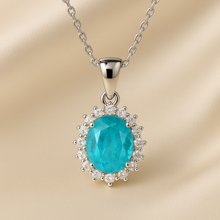 Small Paraíba tourmaline pendant necklace in sterling silver with gemstone halo