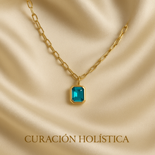Small blue-green gemstone necklace on chunky gold chain