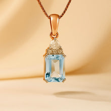 	Rose gold aquamarine pendant with white quartz on soft background
