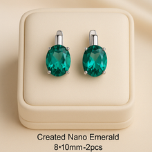 Vibrant green nano-emerald gemstone earrings luxury jewelry close-up
