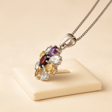 Multigemstone sterling silver necklace on cream velvet stand