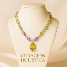 Multi-gemstone necklace set on cream satin background with earrings displayed.