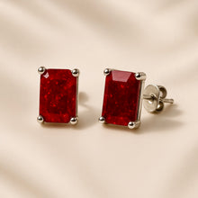 Boho statement ruby earrings on cream satin