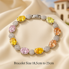 Luxury multi-stone sterling silver healing bracelet by Curación Holística featuring yellow, pink, green, and orange gemstones on a satin cream background with Spanish villa backdrop.
