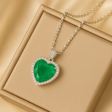 Heart-shaped nano emerald pendant on satin jewelry box