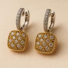 	Handmade white quartz earrings in gold and rose gold over sterling silver