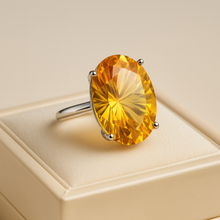 Side angle showing sunburst facets of natural citrine gemstone in a four-prong setting.”