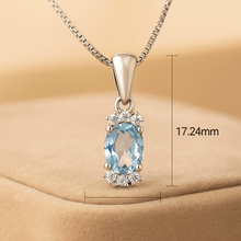 	Natural aquamarine pendant necklace in sterling silver on velvet background