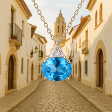 Blue topaz necklace on soft luxury fabric background