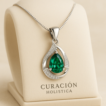 Close-up of green emerald glass-filled stone with white quartz accent