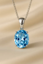 Necklace shown on a cream satin jewelry bust