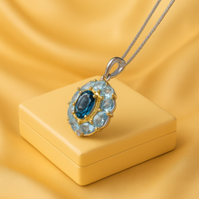 	London blue topaz and aquamarine necklace on soft beige jewelry box